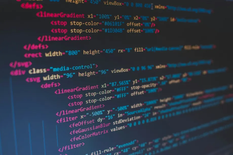 Lines of colorful HTML code in a dark code editor on a computer screen